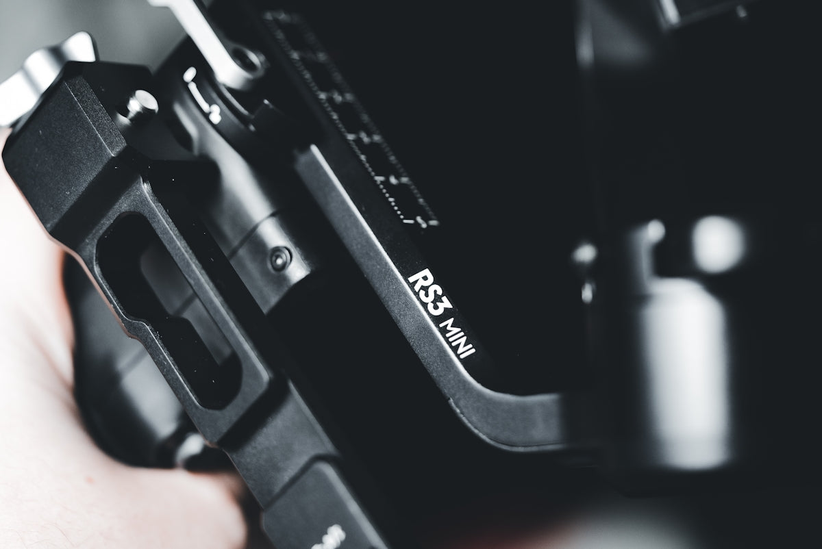 a close up of a person holding a camera